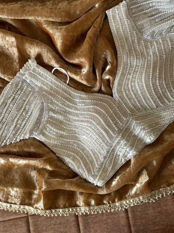 Premium space silk saree with lace and pearl work stitched blouse